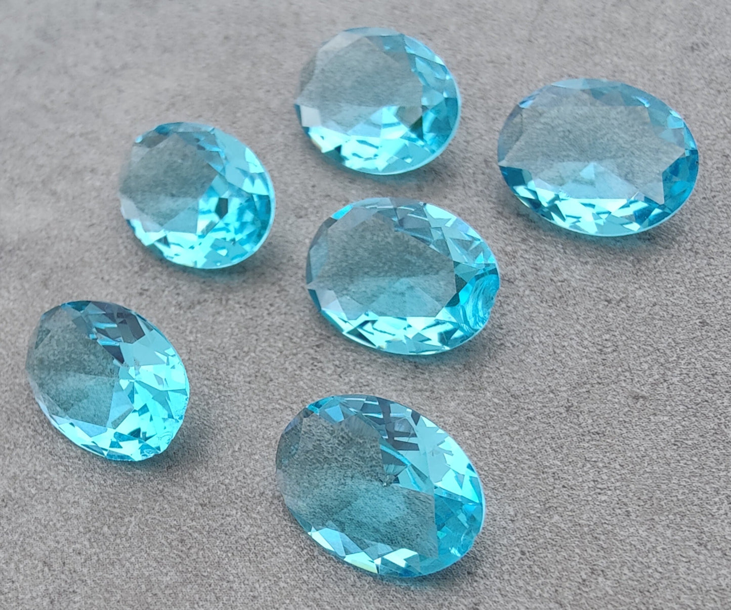 NATURAL BLUE TOPAZ OVAL SHAPE FACETED CUT FLAT BACK CALIBRATED OVAL SHAPEGEMSTONES, ALL SIZES AVAILABLE