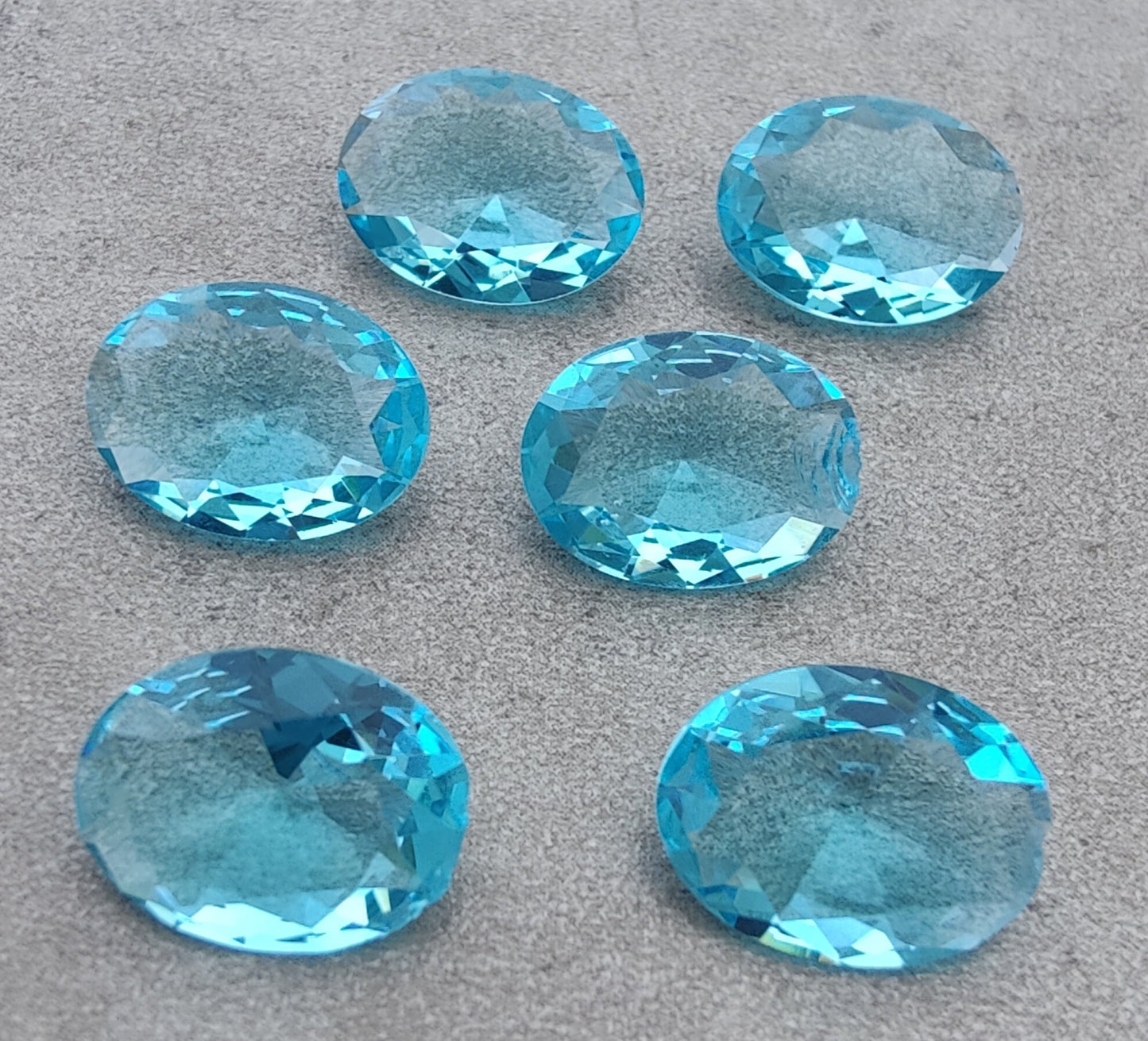 NATURAL BLUE TOPAZ OVAL SHAPE FACETED CUT FLAT BACK CALIBRATED OVAL SHAPEGEMSTONES, ALL SIZES AVAILABLE