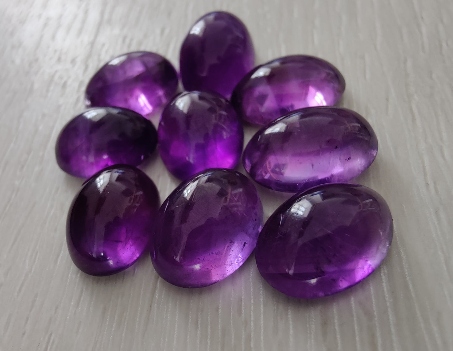 NATURAL AMETHYST OVAL SHAPE FLAT BACK CABOCHON AAA+ QUALITY CALIBRATED GEMSTONES. ALL SIZES AVAILABLE
