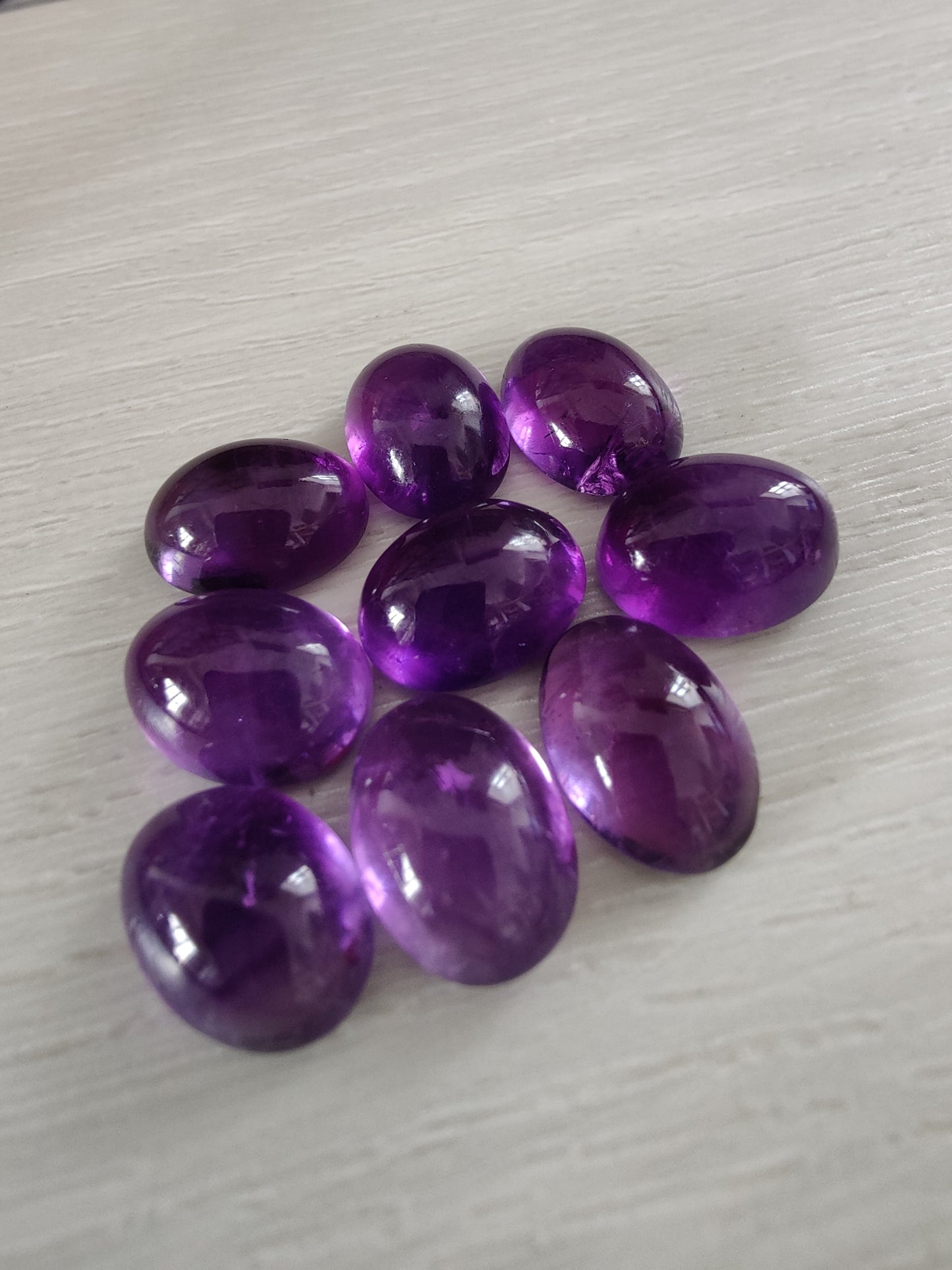 NATURAL AMETHYST OVAL SHAPE FLAT BACK CABOCHON AAA+ QUALITY CALIBRATED GEMSTONES. ALL SIZES AVAILABLE